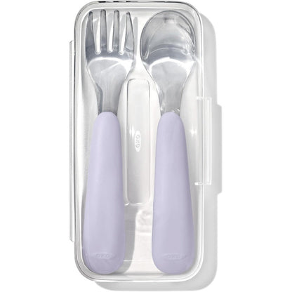 OXO Tot On-The-Go Fork and Spoon Set Lilac front view inside its open translucent travel carrying case.