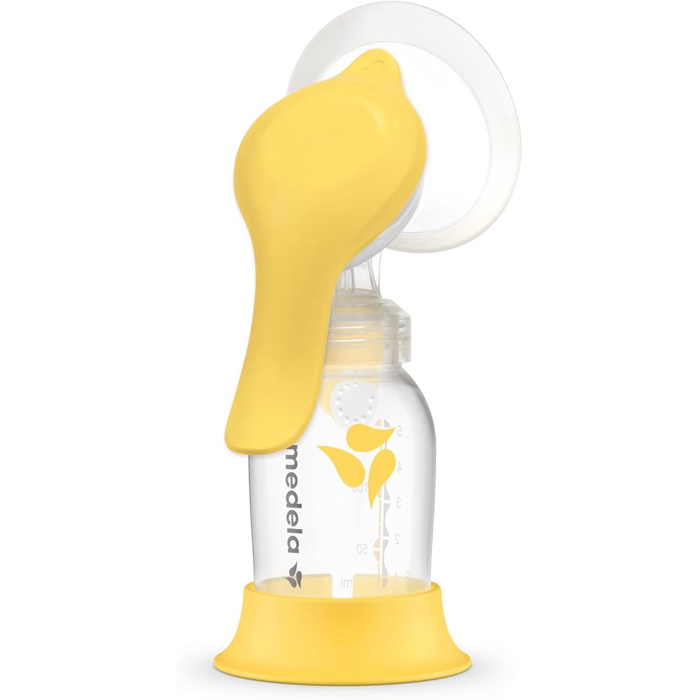 Medela Harmony manual breast pump front view showing ergonomic yellow handle and shield