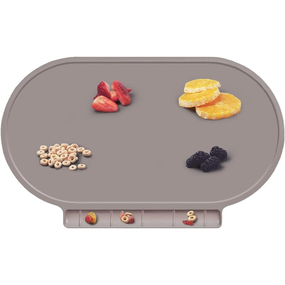 Hey Kids silicone baby placemat front view showing the built-in gray food catching holder pocket on a dining table