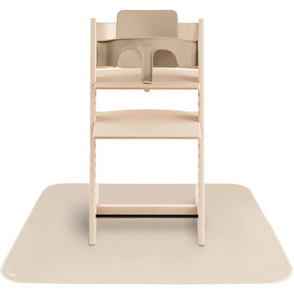 Mushie Baby Splat Mat in Fog front view under a wooden high chair
