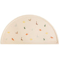 Mushie silicone placemat for kids front view showing dinosaur pattern on table mat