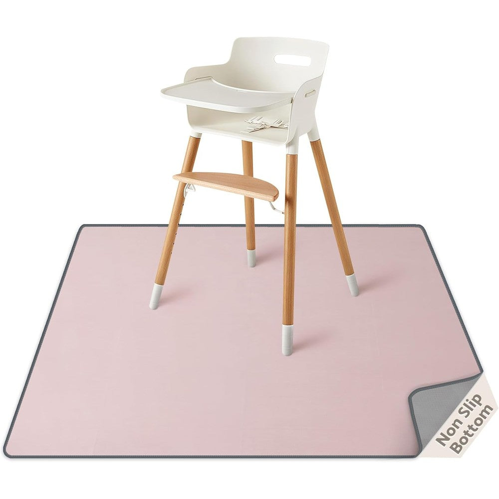 Blissful Diary baby splat mat front view in blush pink placed under a high chair.