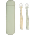 Little Rawr silicone baby feeding spoons green front view of two training utensils inside their protective clear storage box.