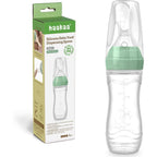 Haakaa silicone baby food dispensing spoon feeder front view showcasing the pea green color profile.