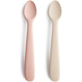 Mushie Silicone Baby Feeding Spoons front view showing Blush and Shifting Sand colors.