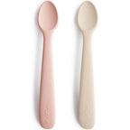 Mushie Silicone Baby Feeding Spoons front view showing Blush and Shifting Sand colors.