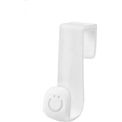 Ubbi Multi Use Potty Hook front view holding a toddler training seat next to a toilet tank.