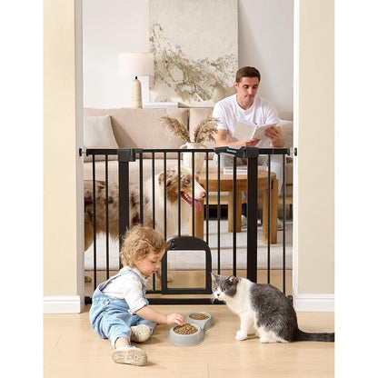 Babelio upgraded baby gate with cat door front view in black steel installed in a doorway.