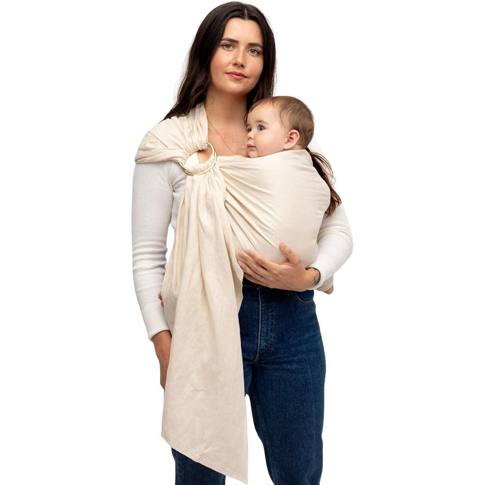 WildBird Ring Sling Baby Carrier in Sparrow vanilla beige colorway being used for a front carry position