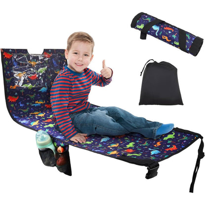 YUMTIM Kids Airplane Seat Extender Travel Bed front view showing the vibrant dinosaur pattern fabric extended on a flight seat.