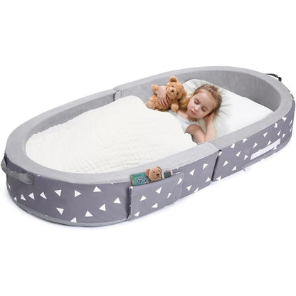 Mooedcoe portable foldable toddler travel bed front view showing grey triangle pattern and protective foam sides.