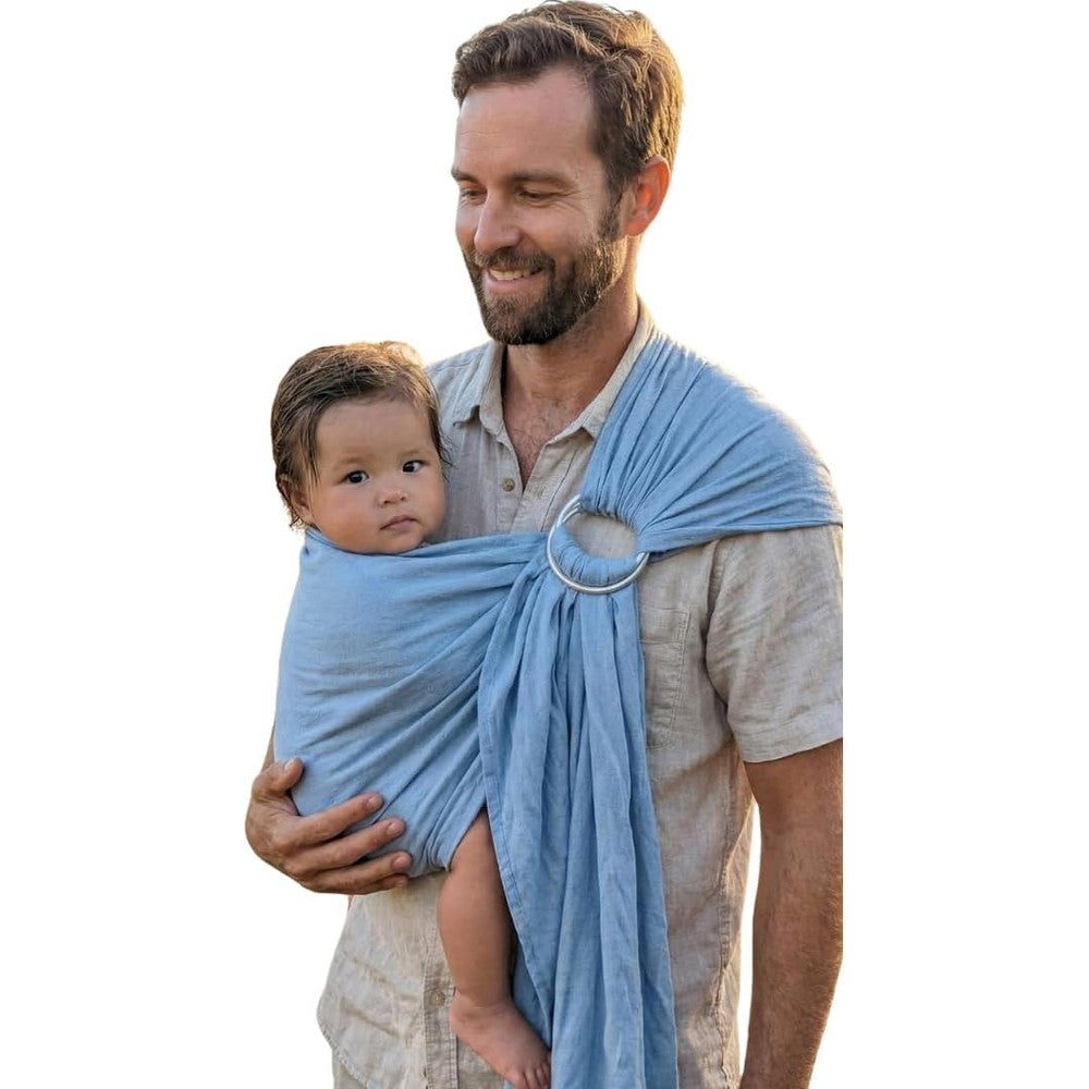 LilymoonBaby Organic Baby Ring Sling Carrier front view featuring the Azure Sky boho hemp wrap design on a parent.