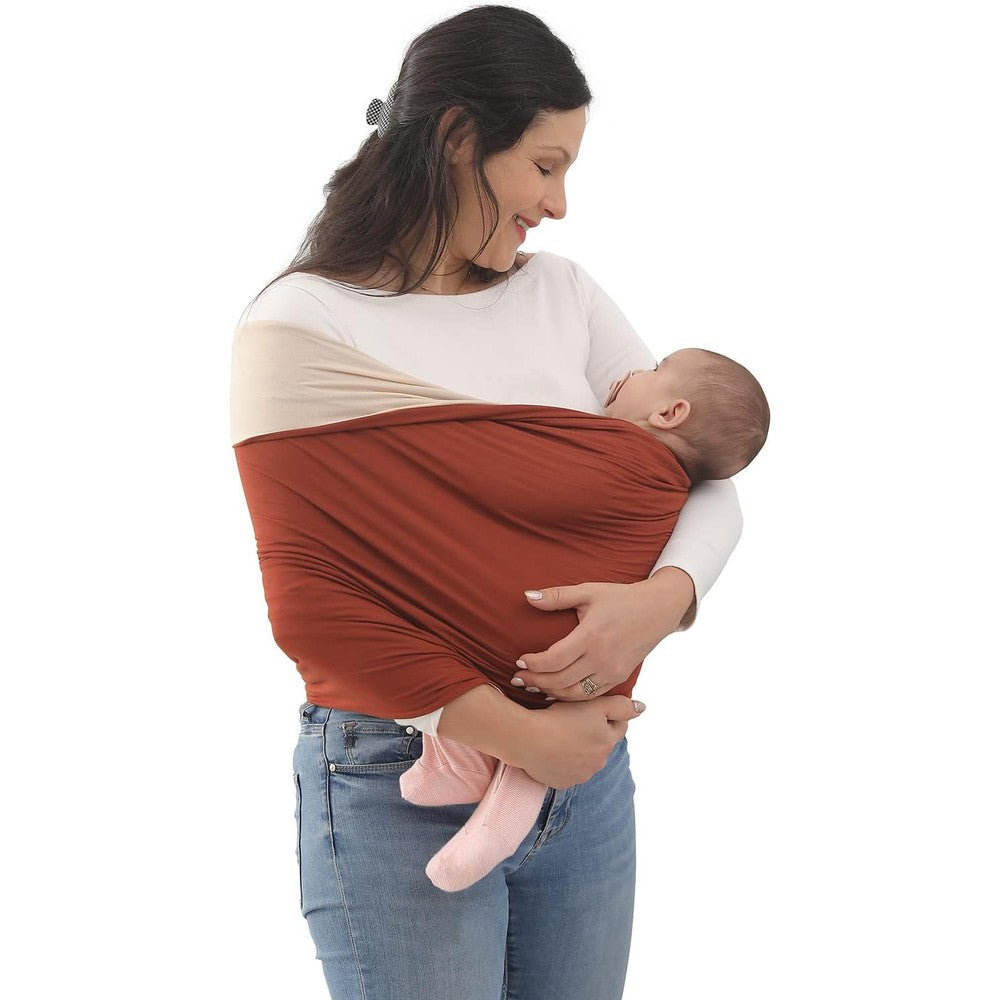 Kloovete Baby Wrap Carrier front view holding a newborn snugly against a mother's chest