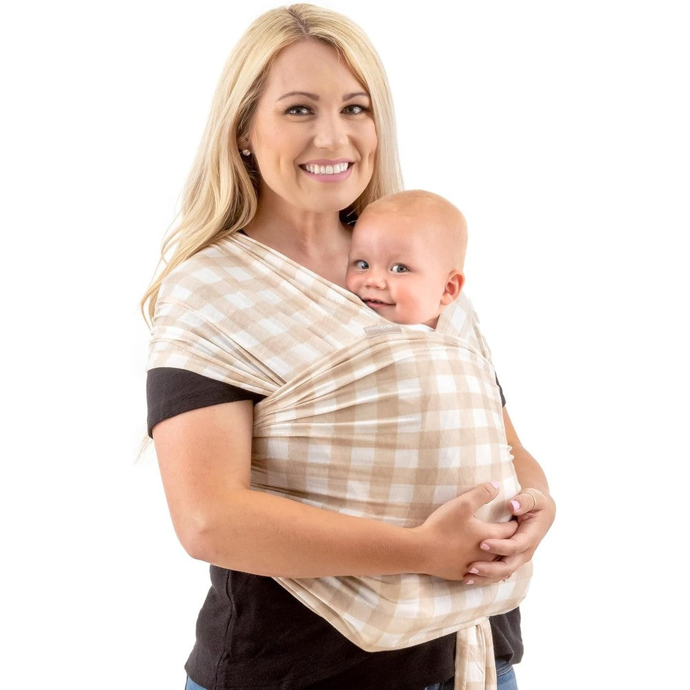 WeeSprout Baby Wrap Carrier front view on mother holding newborn infant.