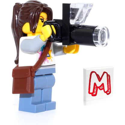 LEGO City Nature Photographer Minifigure front view showing female character holding camera accessory