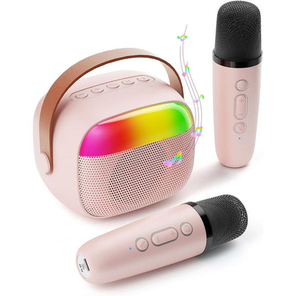Aadmd mini karaoke machine for kids front view showing the pink portable speaker and two matching wireless microphones.