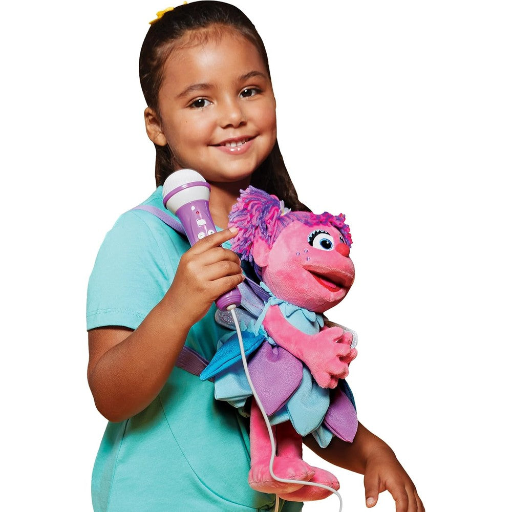 Singing Machine Kids Sesame Street Abby Cadabby karaoke plush toy front view showcasing the working purple microphone.