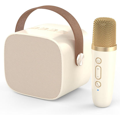 MEGUO Mini Karaoke Machine front view showing the beige speaker and wireless microphone on a clean tabletop.