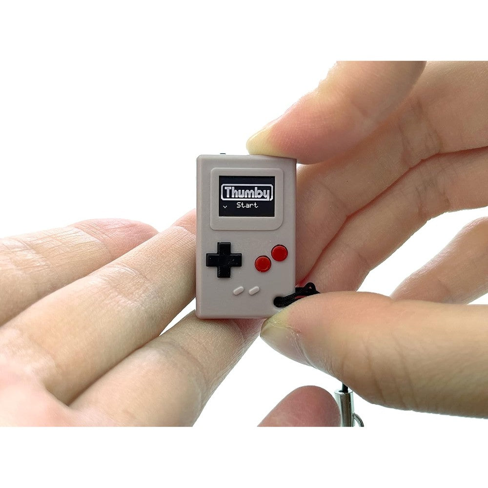 TinyCircuits Thumby gray miniature game console keychain front view showing OLED screen