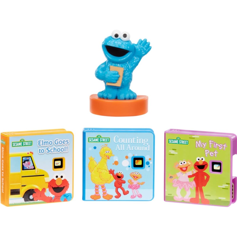 Little Tikes Story Dream Machine Sesame Street Cookie Monster collection packaging front view featuring the three story cartridges and character toy
