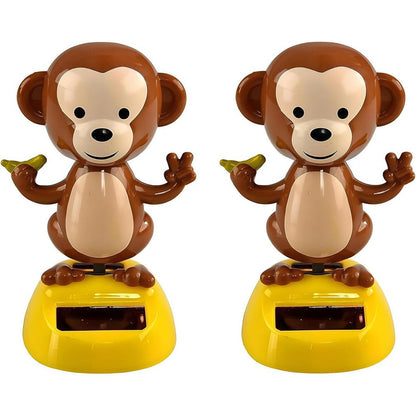 Enyolidimk solar powered dancing monkey figure front view on car dashboard