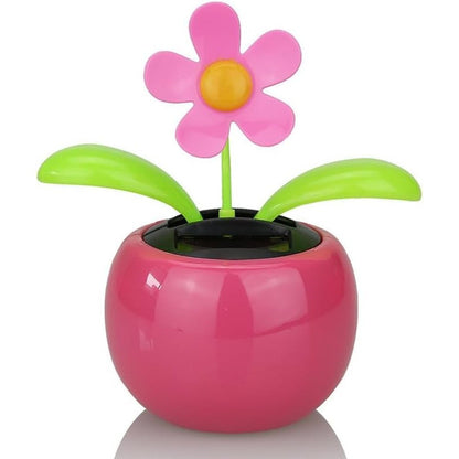 Xinjincang Pink Solar Dancing Sun Flower Automotive Ornament front view on car dashboard.