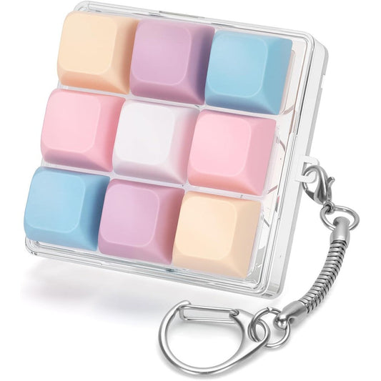 Netholid mechanical keyboard fidget toy front view showing nine pastel-colored keycaps inside a clear protective case.