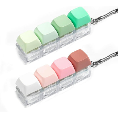 Mintcaps keyboard fidget toy 2 pieces pack front view featuring colorful mechanical keycaps on a transparent base.