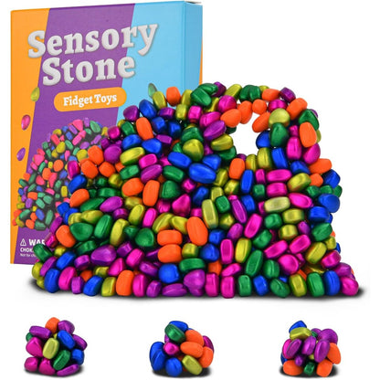Aukit 550 piece adult fidget toys front view showcasing six vibrant colors of smooth ferrite stones in a neat arrangement.