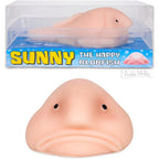 Archie McPhee Accoutrements Sunny The Blobfish novelty squishy toy front view highlighting its iconic sad frown expression.