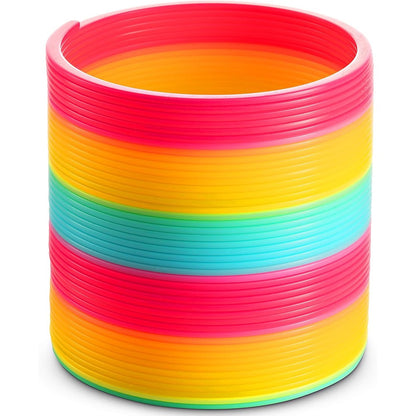 Bedwina Jumbo Rainbow Spring Coil Toy front view showing giant 6 inch neon multi color plastic slinky layers.