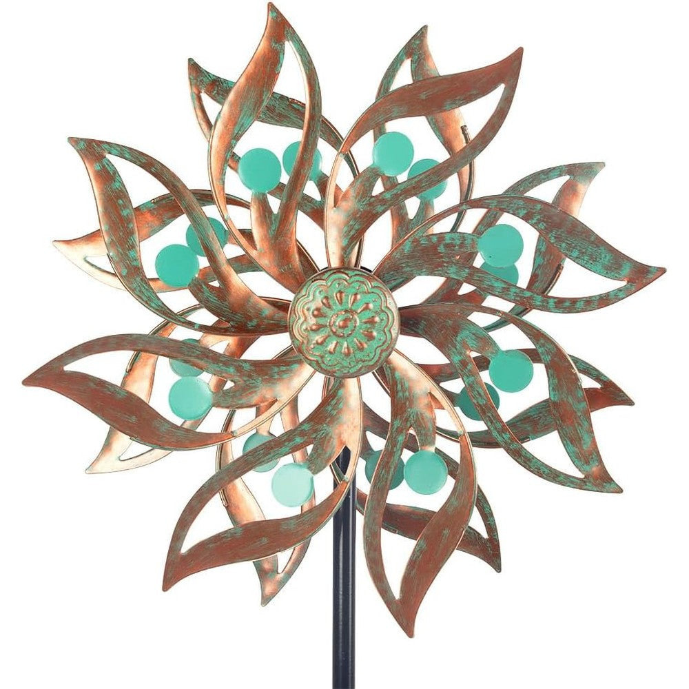 Viveta metal wind spinner front view displaying the vintage copper floral blades and green bead accents in a garden.