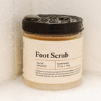 FootFitter exfoliating foot scrub jar open showing creamy salt texture